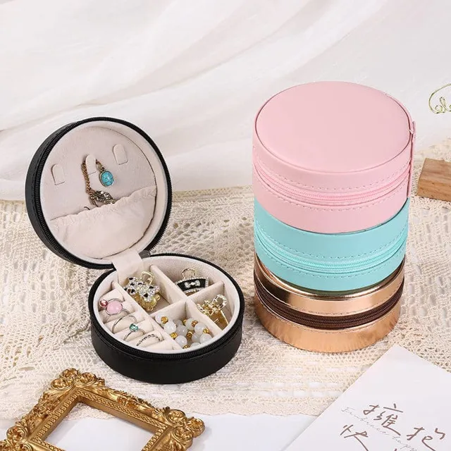 Pink, mint and black round cases stacked and opened