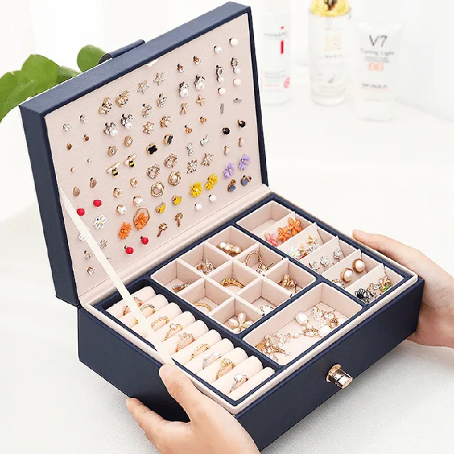 Navy jewelry case open fully showing the stud panel