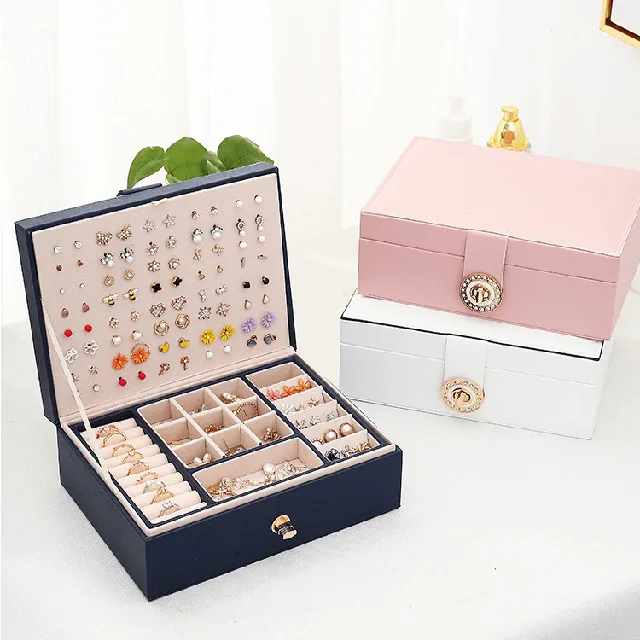 Navy, pink and white two-layer jewelry cases arranged together