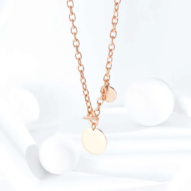 Rose gold disc pendant, close view