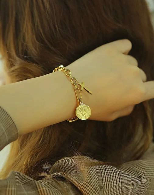 Model from behind wearing the gold coin bracelet