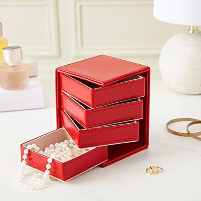 Red rotating drawer tower styled on a dressing table