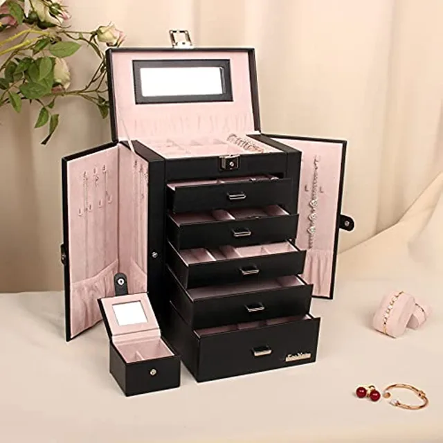 Black jewelry cabinet styled with jewelry and a hand mirror