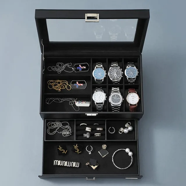 Open black box showing watches, jewelry tray and drawer