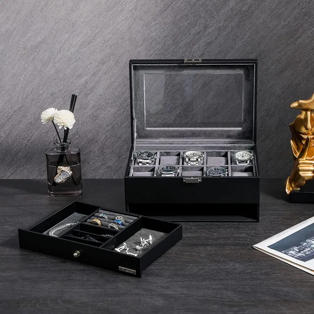Black watch and jewelry box styled on a dark textured background