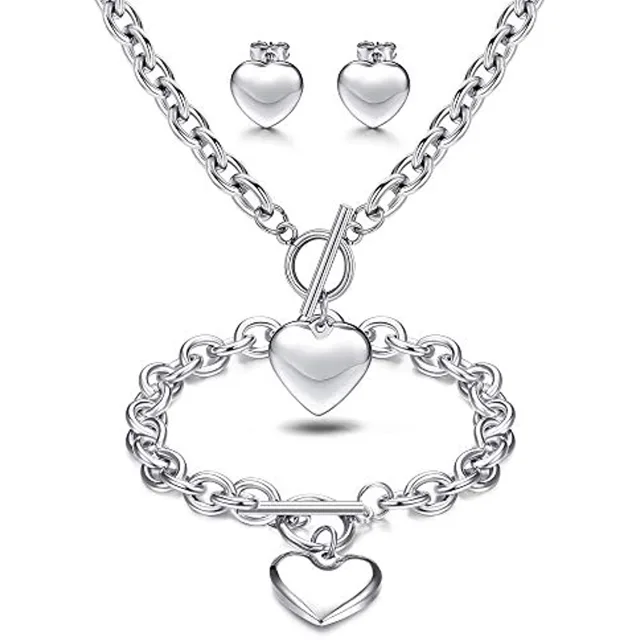 Silver heart pendant, bracelet and studs, close view