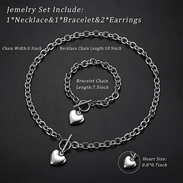 Silver heart necklace and bracelet on dark background