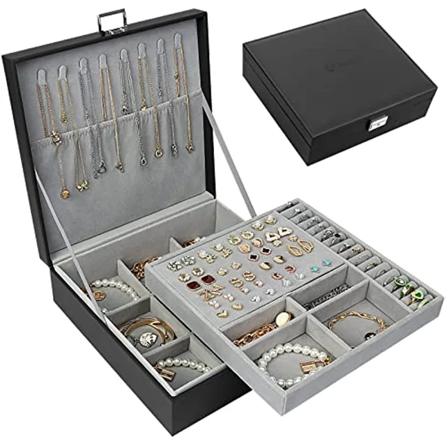 Black two-layer jewelry box open showing necklace hooks and tray