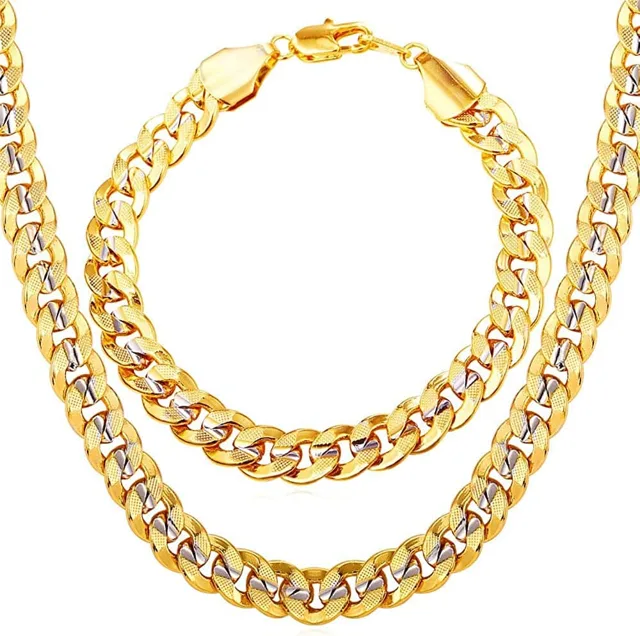 Gold Cuban link necklace and bracelet set arranged together