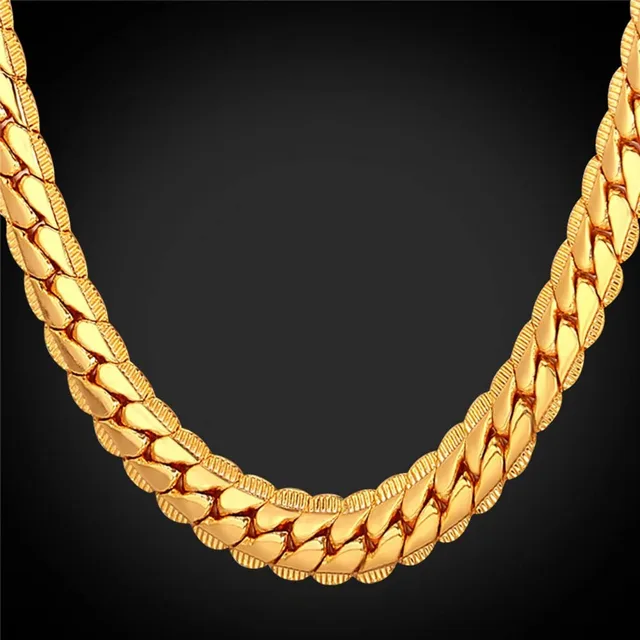 Close view of a gold Cuban link chain showing the links