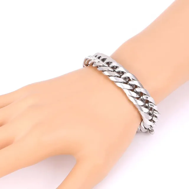 Silver Cuban link bracelet worn on a wrist