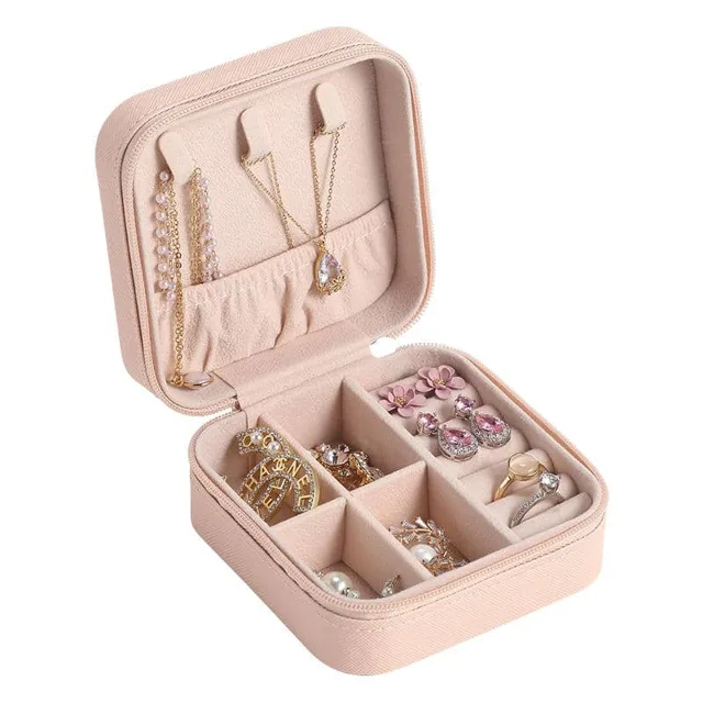 Blush square jewelry case open and filled with jewelry
