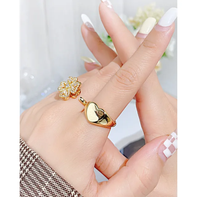 Hand wearing the heart ring, close view