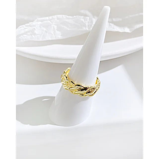Twisted gold ring on a ring cone