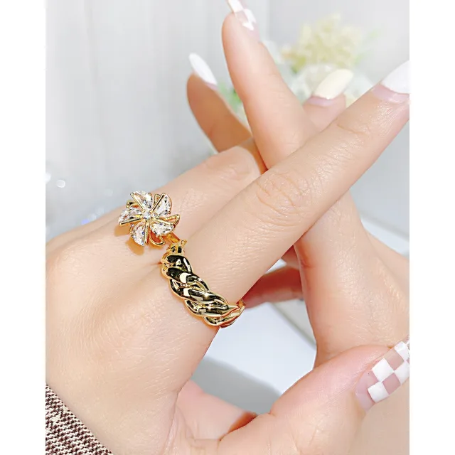 Hand wearing the twisted ring, second angle