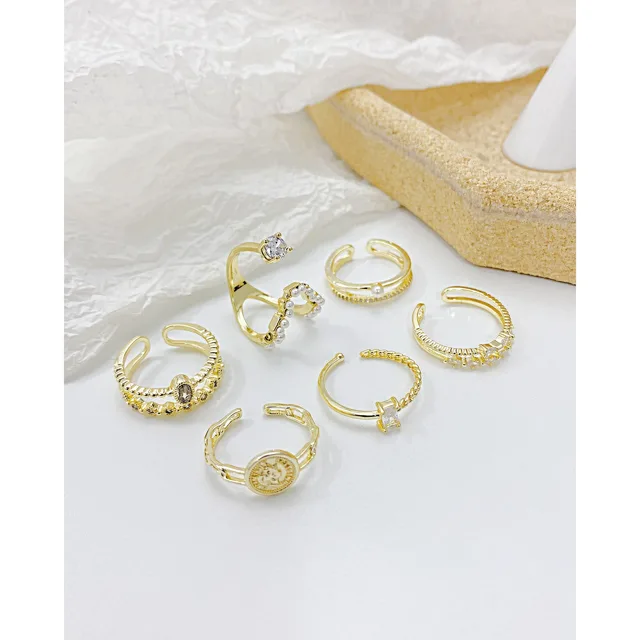 Group of gold star rings arranged together