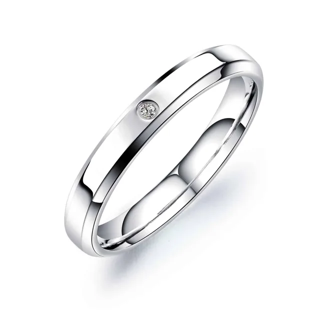 Single silver wedding band with a small stone, close view