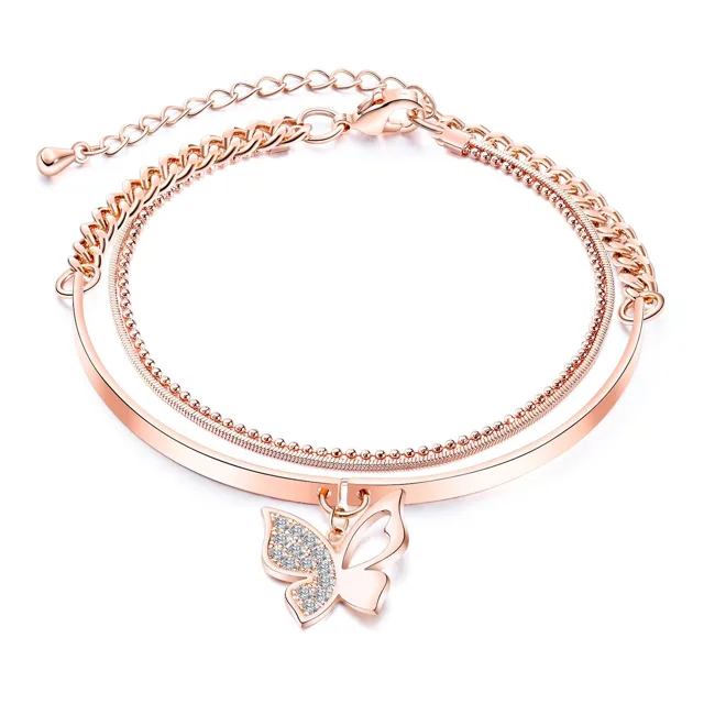 Rose gold layered bracelet with a butterfly charm