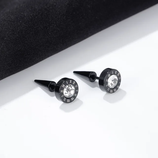 Black numeral studs laid on dark fabric