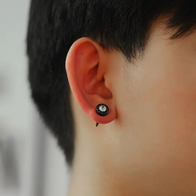 Ear wearing the black crystal stud