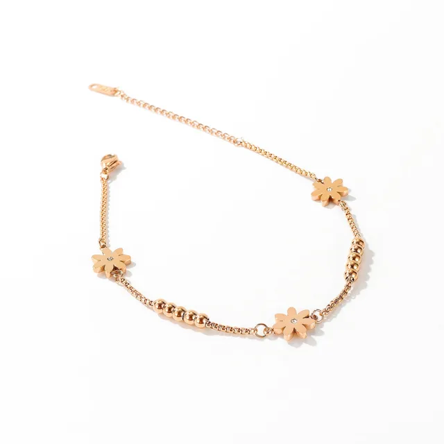 Flower anklet laid at an angle on white