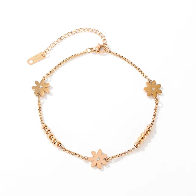 Rose gold flower anklet with zircon centres, flat lay