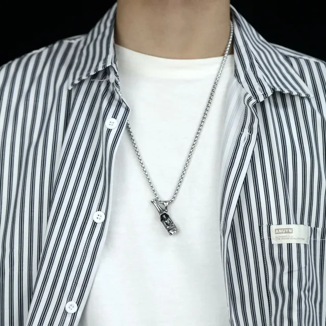 Model in a striped shirt wearing the bottle pendant