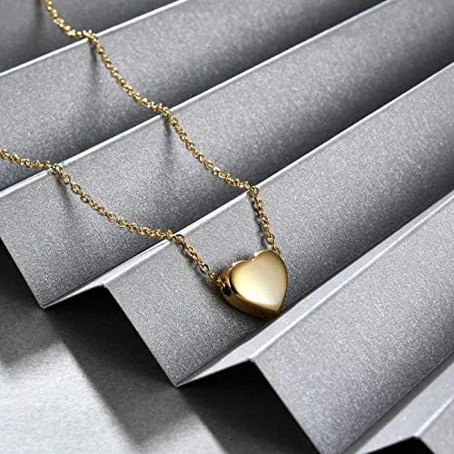 Close view of a gold heart pendant on its chain