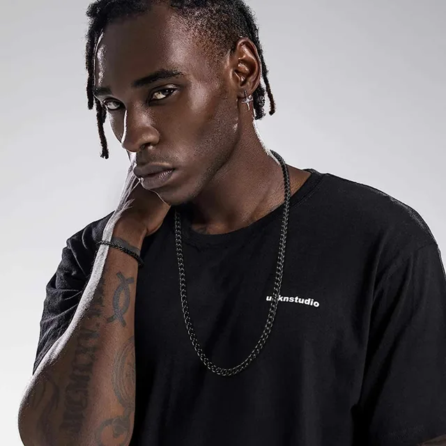 Model in black wearing the black wheat chain