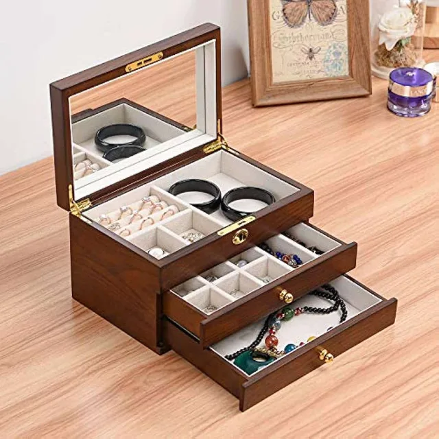 Wooden chest open with a bracelet drawer extended