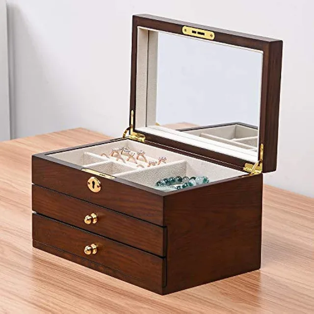 Wooden chest open with three drawers closed and mirror up