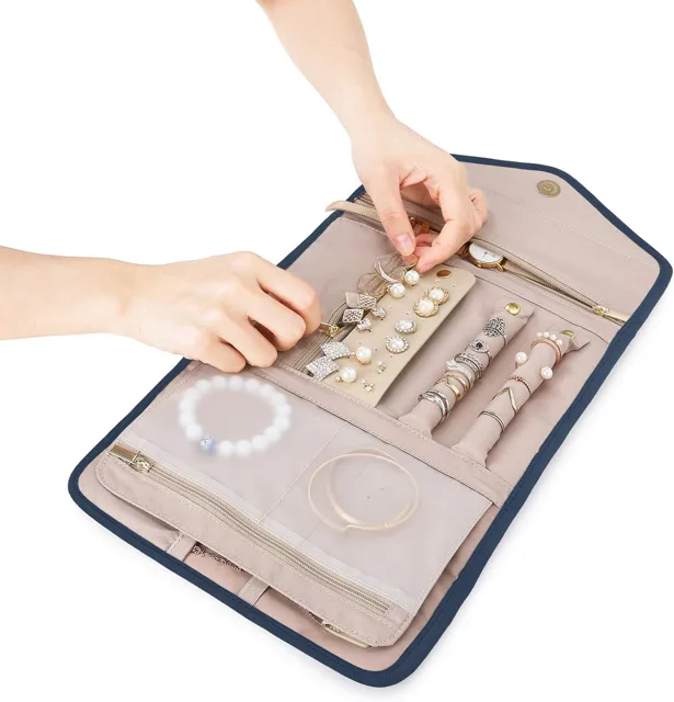 Hand pressing a stud earring into the roll panel