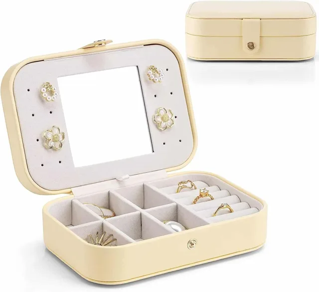 Cream jewelry case closed behind the open display tray