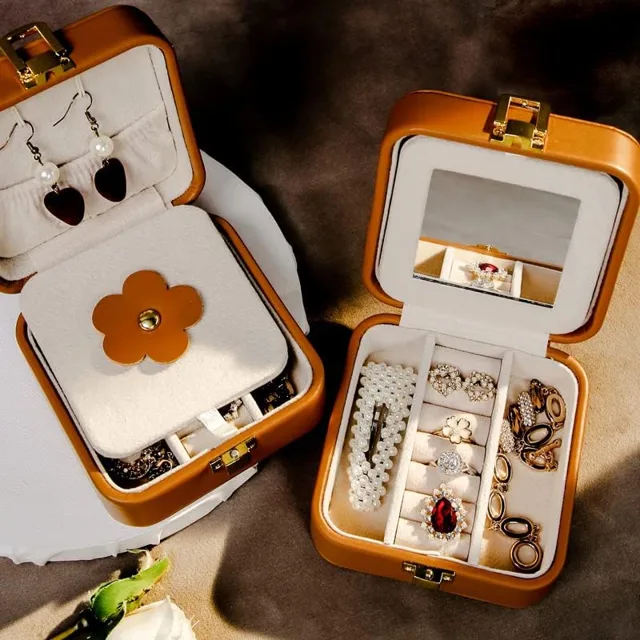 Caramel case open with jewelry on a warm brown set