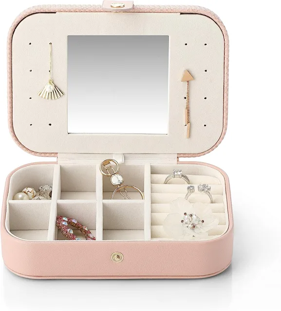 Pink travel jewelry box open with mirror and ring slots