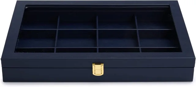 Closed navy jewelry display case, front angle, gold clasp