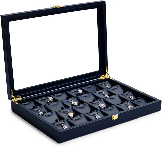 Navy jewelry case with glass lid open showing filled ring slots
