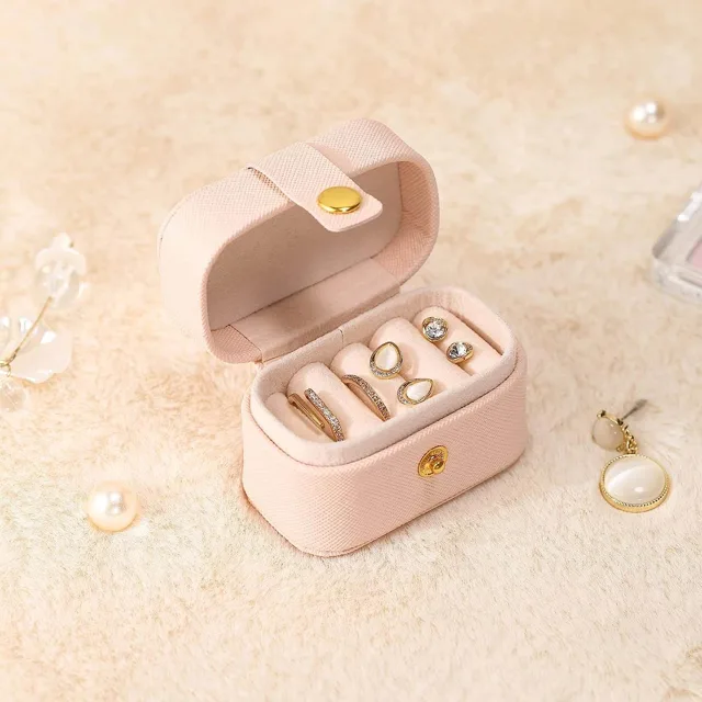 Blush mini case open with earrings, close view
