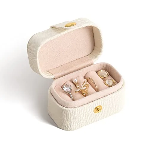 Cream mini case open and filled with jewelry