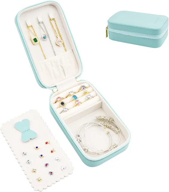 Mint zip case open with a necklace laid across the slots