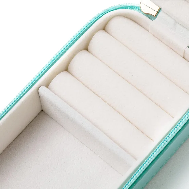 Close view of the white roll slots inside the mint case
