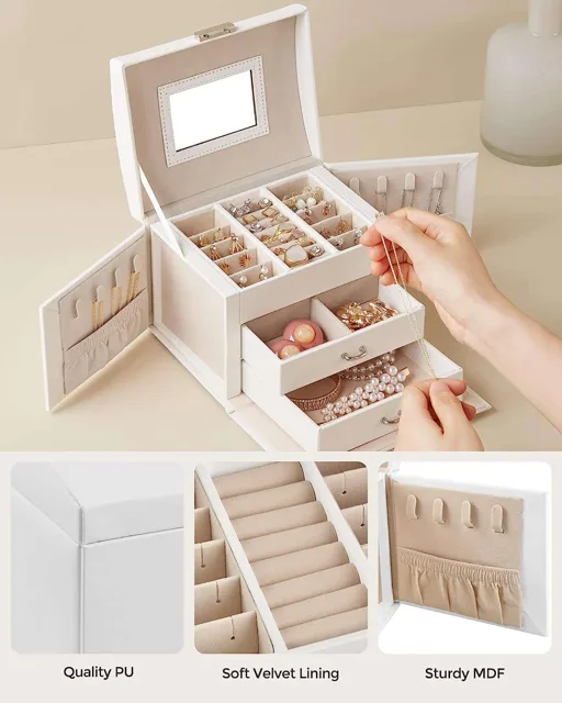 Hands placing jewelry into the white box trays