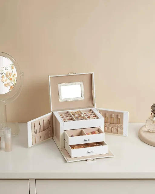 White jewelry box styled open on a cream dressing table