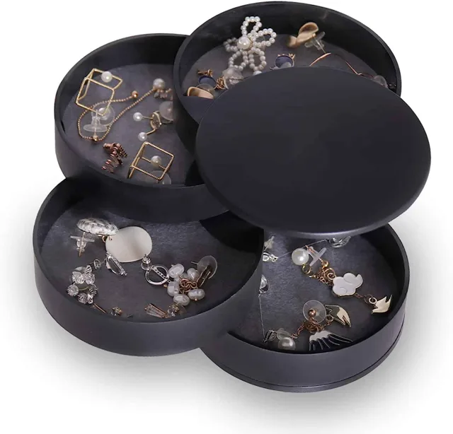 Black four-layer round tower opened flat with jewelry on each tier