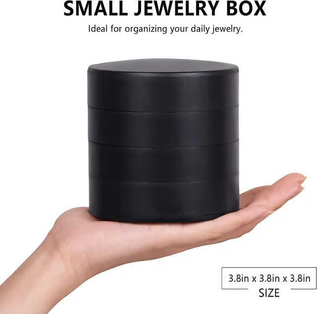 Hand holding the small round tower with a size note
