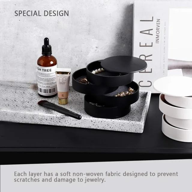 Black tower styled beside skincare bottles on a vanity