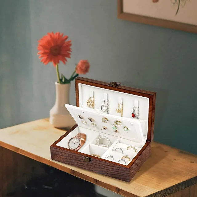 Wooden box styled open with a red flower in a vase
