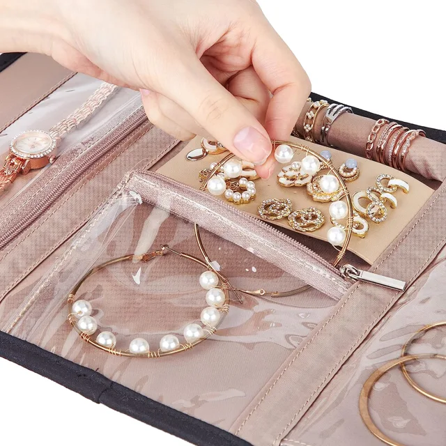 Hand placing a pearl bracelet into the organizer pocket