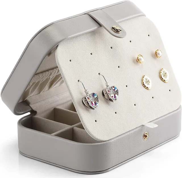 Grey jewelry box half open showing the stud panel