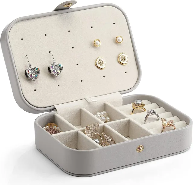 Grey travel jewelry box open flat with six compartments